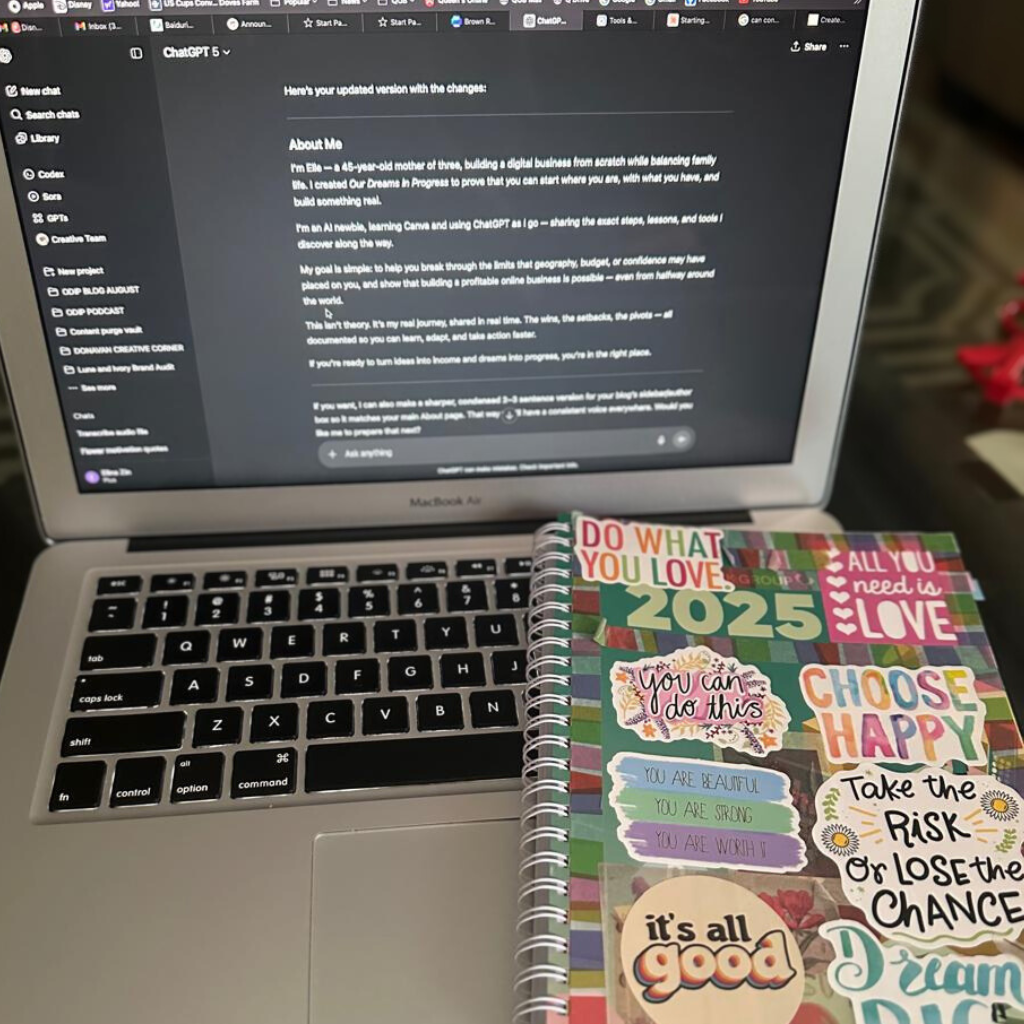 Laptop with an open screen beside a colorful 2025 planner.