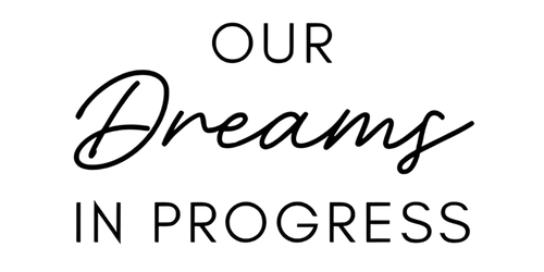 Minimalist black and white text logo with the phrase “Our Dreams in Progress.”