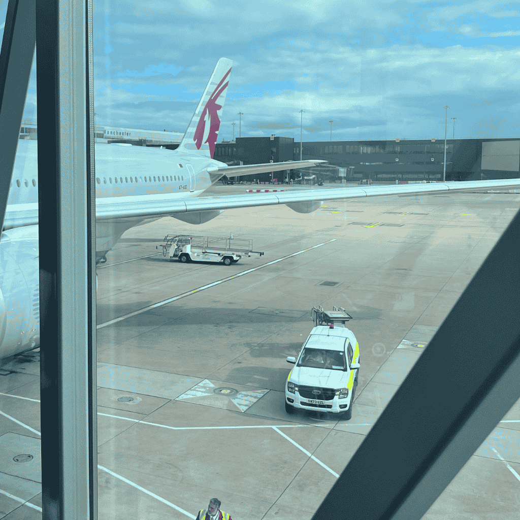 Letting go as a mother while watching the airport runway through a terminal window as my firstborn’s plane prepares for departure.