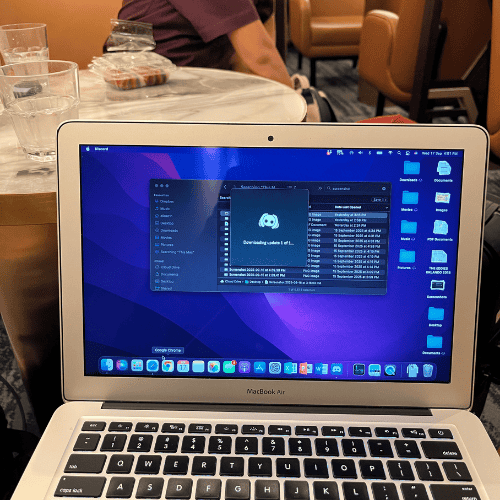 Letting go as a mother while working remotely on my laptop, balancing online tasks during an emotional transition.
