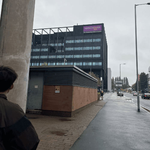 Letting go as a mother while walking with my firstborn near the University of Manchester on his first day of independence.